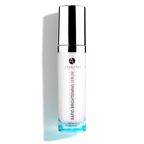 ANJALI MD Skincare Rapid Brightening Serum shown open with serum dots on a gradient pink background