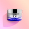 ANJALI MD Brightening Retinol Night Cream without the cap and with the cream peaking over the top.Brightening Retinol Night Cream jar