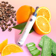ANJALI MD Skincare Illuminating Eye Concentrate next to some of it's ingredients: Coffee, Oranges, Aloe.