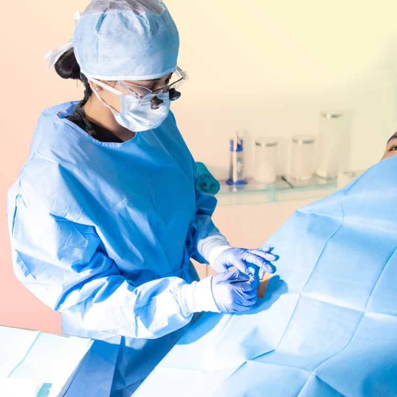 Dermatologist and Skin Surgeon Dr. Anjali Butani seen performing a surgical procedure on a patient in Orange County, CA in 2021.