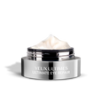 ANJALI MD Yeux Ultimes, Ultimate Eye Wrinkle Repair. A round chrome jar with YEUX ULTIMES ultimate eye repair on the front. The Cap is off and in the background. The light sand-colored cream is peaking over the top of the jar.