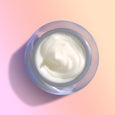 Brightening Retinol Night Cream jar, open and from above showing the light cream color