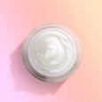 ANJALI MD Skincare Heavenly Moisturizing Cream Jar pictured from above on a pink background