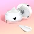 ANJALI MD Skincare Heavenly Moisturizing Cream - Jar pictured next to a white cream smear