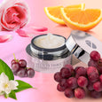 ANJALI MD Ultimate Eye Wrinkle Repair Cream, shown next to Oranges, Roses, Grapes and Magnolia - All ingredients used in Ultimate Eye Repair